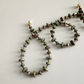 Beaded necklace with unakite 2mmx4mm beads on a light background