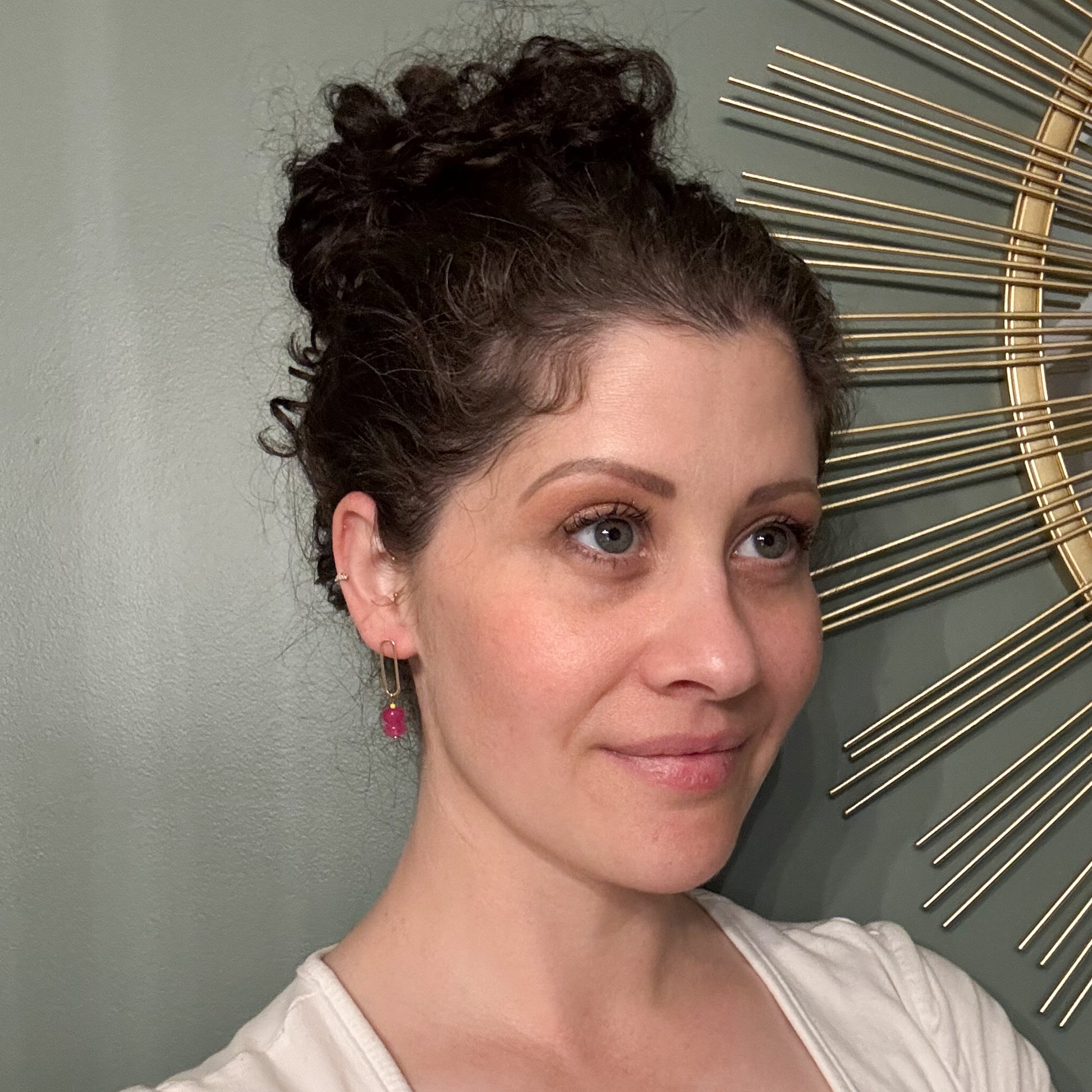 person wearing listed earrings