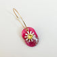 Small pink, polymer clay piece with a cubic zirconia daisy 