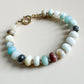 Beaded bracelet with multicolored beads on a light background